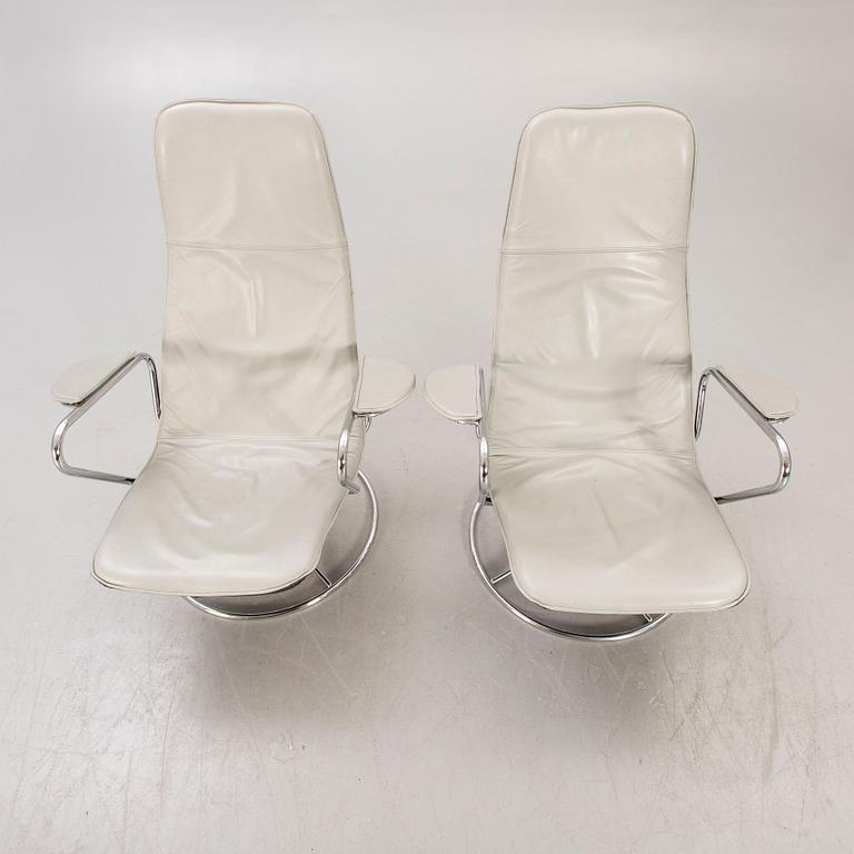 A pair of Tord Björklund Exen leather and chrome swivel chairs for IKEA 1988.