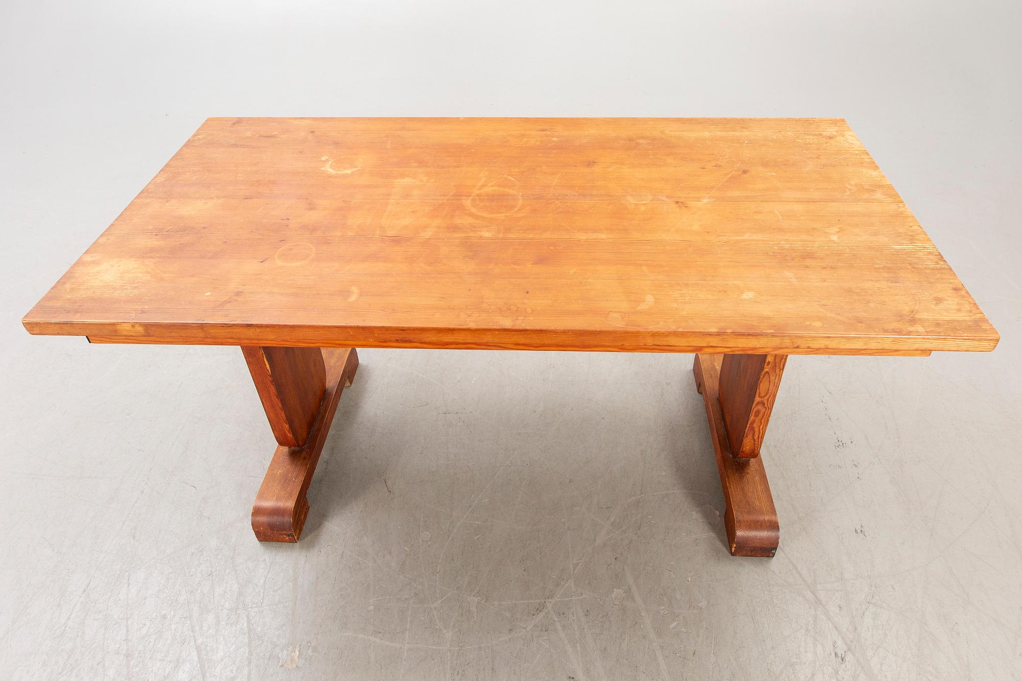 A 1940s pine dining table.