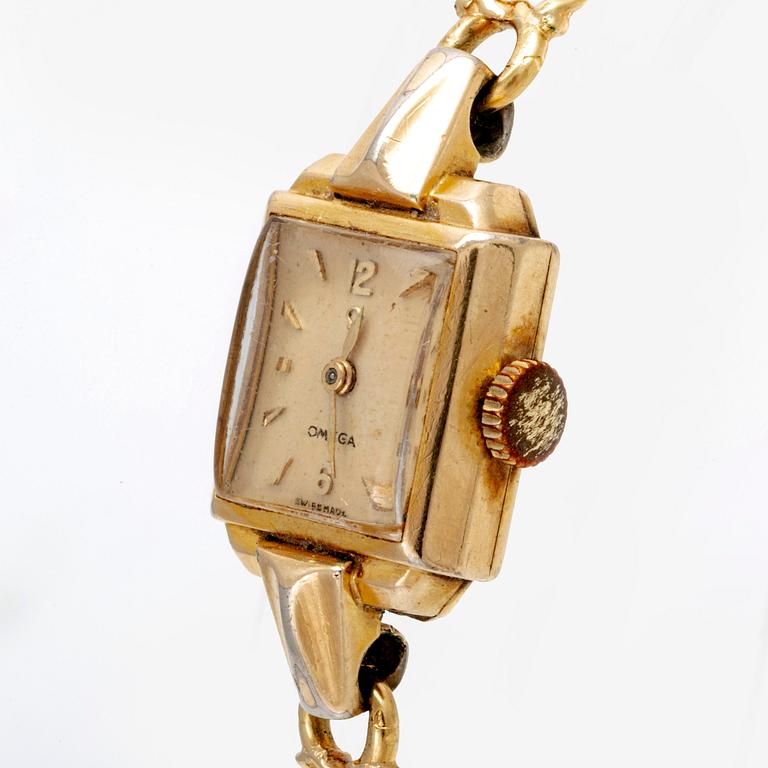 An 18 K gold wrist watch, Omega. Toral weight incl the watch 16 grams.