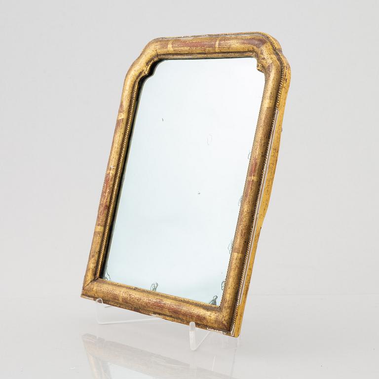 A 18th century mirror,.