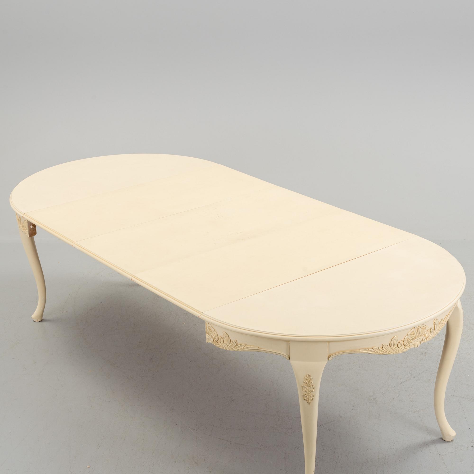 A mid 20th century rococo style dining table.