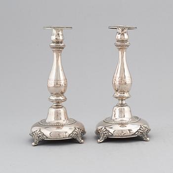 A pair of silver candlesticks, circa 1900.