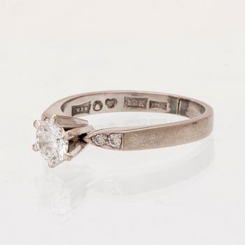 An 18K white gold ring set with round brilliant cut diamonds by Lundberg Guldatelje Amie Stockholm 1977.