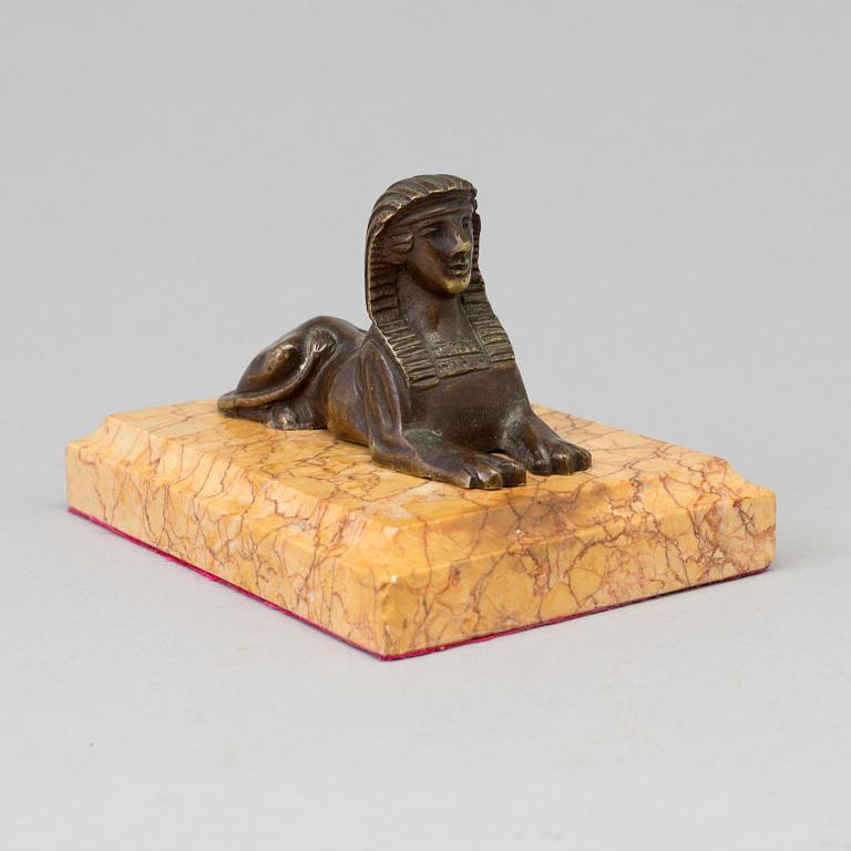 AN EMPIRE  BRONZE AND MARBLE PAPER WEIGHT, early 19th century.