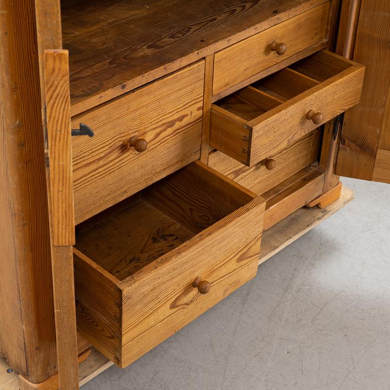 A pinewood cabinet, later part of the 19th Century.