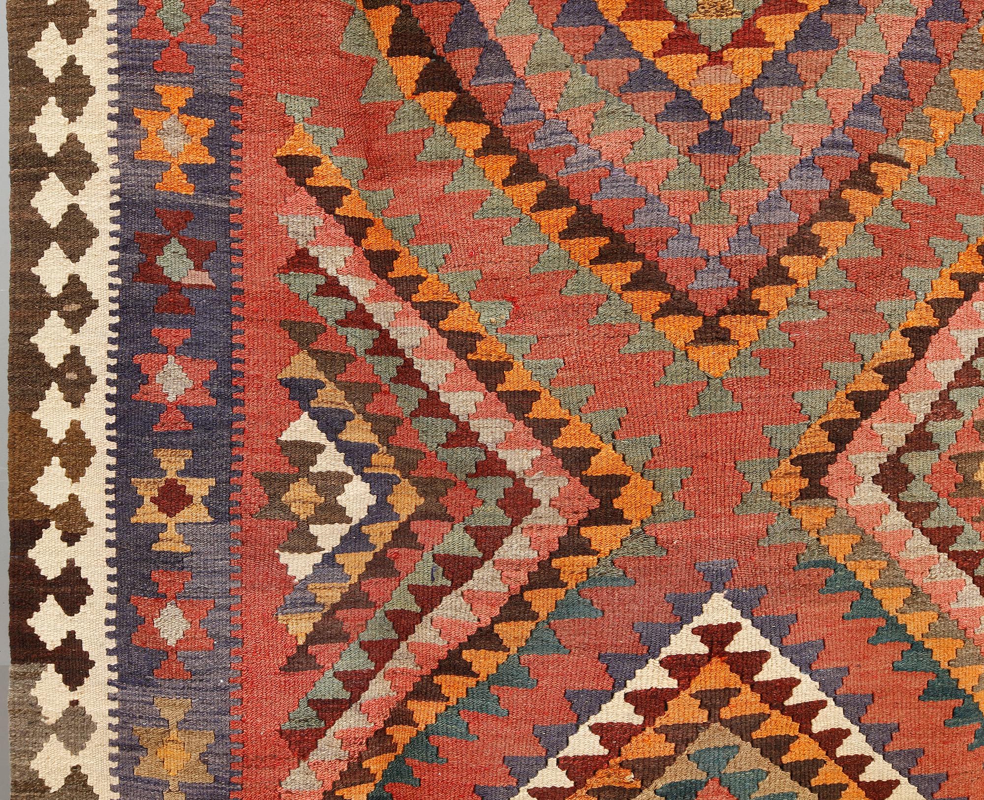 A persian nomadic kilim, approximately 420 x 190 cm.