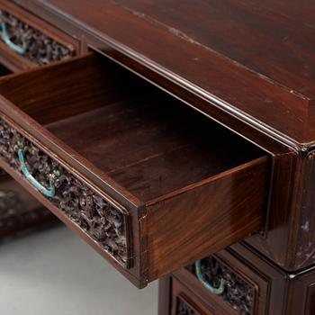 A carved hardwood desk, late Qing dynasty, circa 1900.