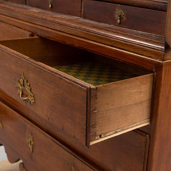 A mid 18th century rococo oak cabinet.