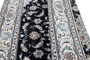 A Nain carpet, part silk, c. 286 x 206 cm.