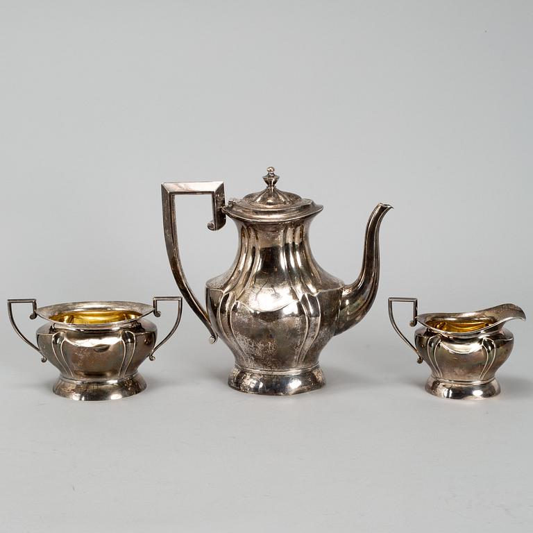 A silver coffee pot, creamer and a sugar bowl, Oulu, Finland 1921.