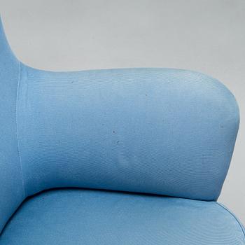 A pair of mid-20th-century armchairs.