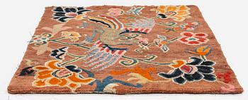 An antique 'Khagangma' rug, Tibet, around 1900. c. 74x63 cm.