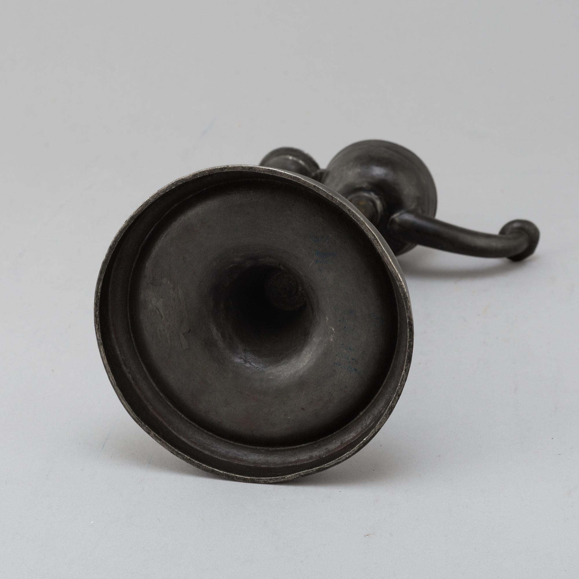 An 18th century pewter oil lamp.