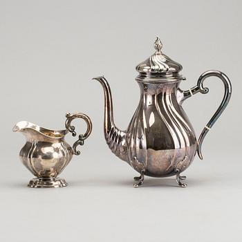 A DANISH COFFEE POT AND A SWEDISH CREAMER, silver.