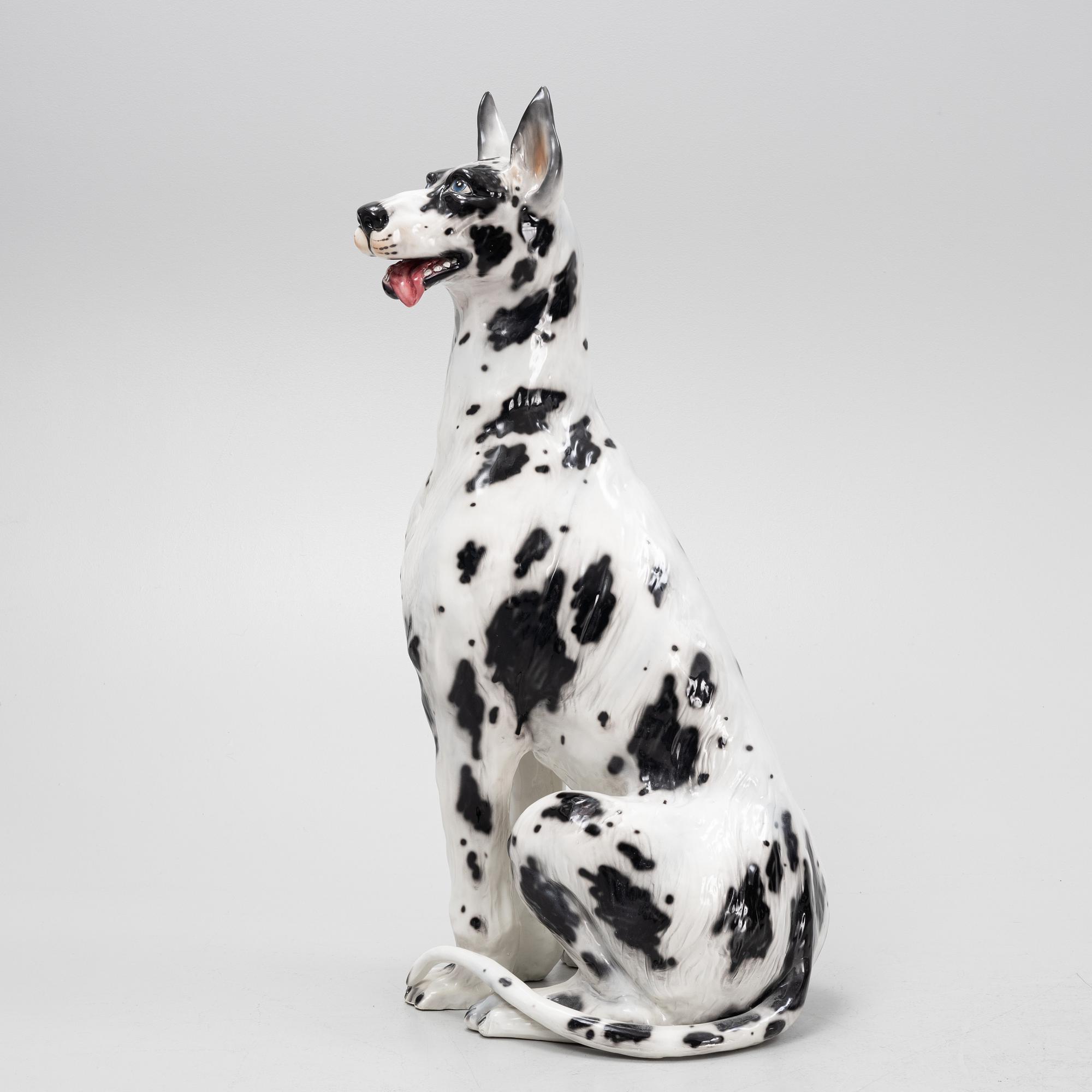 A ceramic decorative sculpture of a dog, late 20th Century.