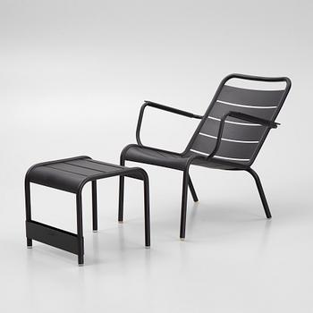 A Luxembourg lounge chair and a foot stool Fermob. Bukowskis