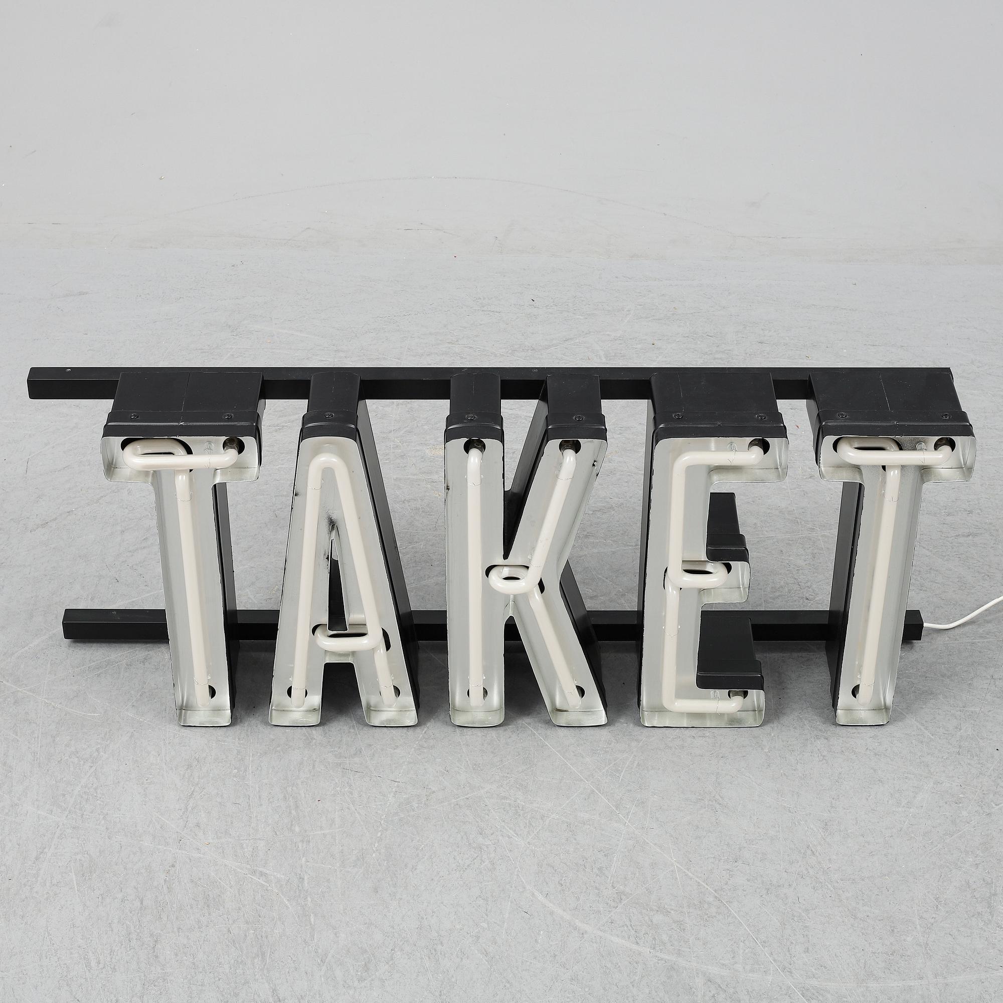 A neon sign "TAKET", late 20th century/21st century.