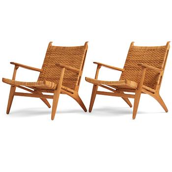 Hans J. Wegner, a pair of oak and rattan 'CH-27' chairs, Carl Hansen & Son, Denmark.