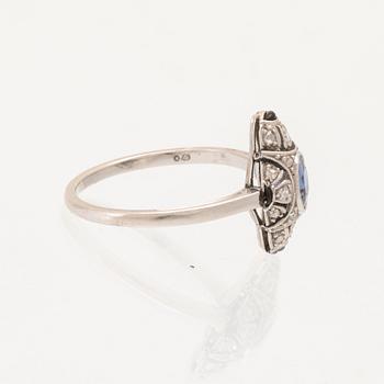 Art Deco platinum ring with an oval faceted sapphire and old-cut and rose-cut diamonds.