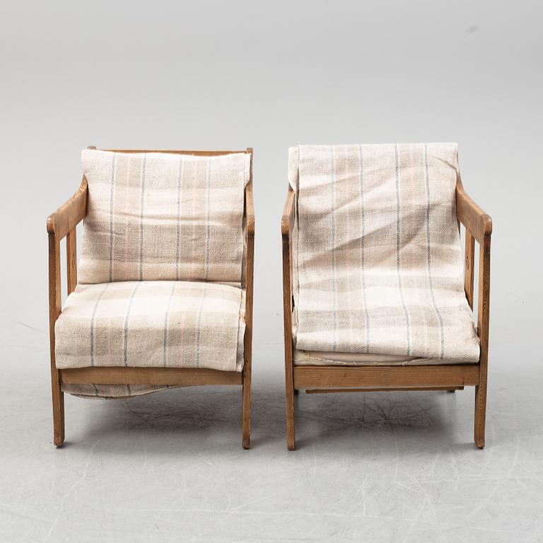 A pair of pine armchairs attributed to Carl Westman, early 20th Century.