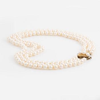 Three-row pearl necklace, cultured pearls, gold clasp with octagonal cut diamonds.