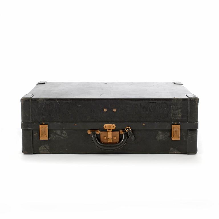 HERMÈS, a black leather suitcase from the 1950/60s.
