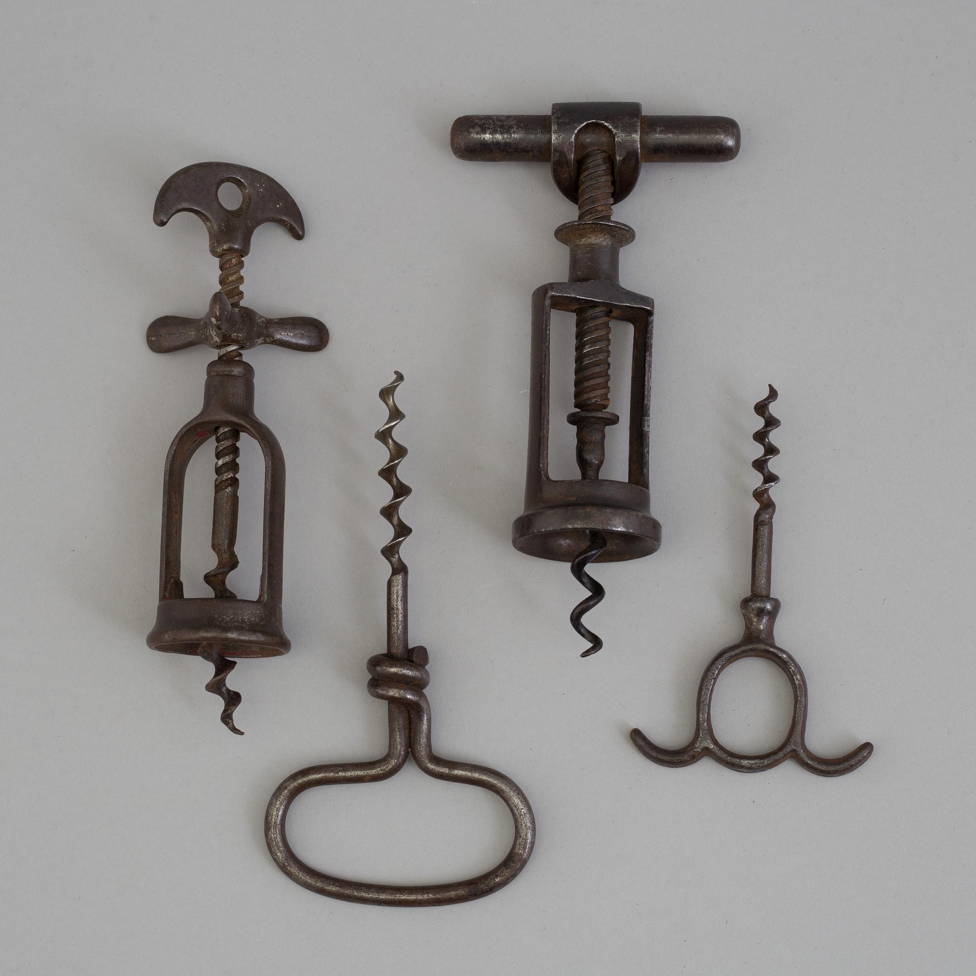 FOUR CAST IRON CORK SCREWS, 19th century.