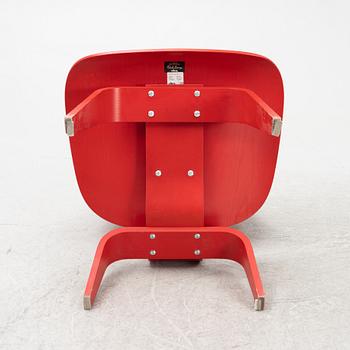 Charles & Ray Eames, a 'LCW' chair, Vitra, dated 2003.