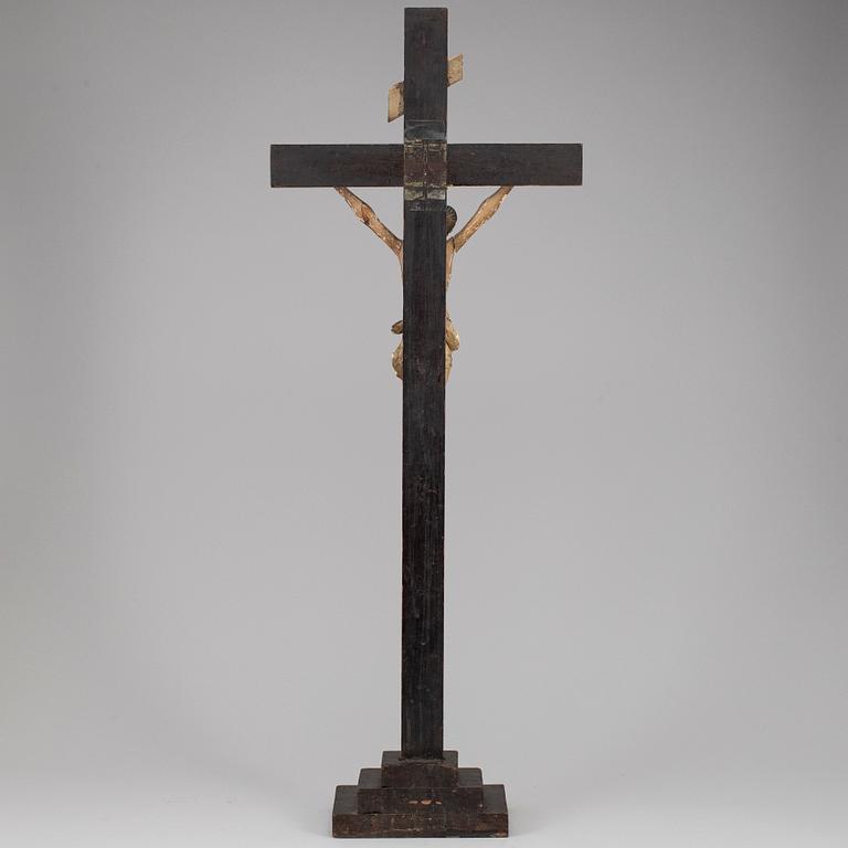 A painted wood crucifix, 18th/19th century.