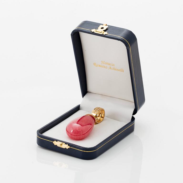 An 18K gold and rhodochrosite Acchinelli pendant set with round brilliant-cut diamonds.