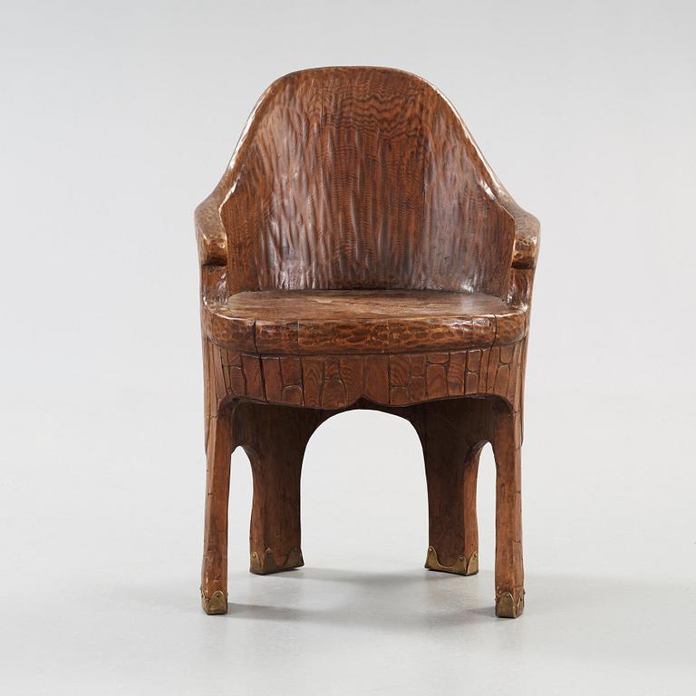 A Gustaf Fjaestad Art Nouveau carved pine chair 'Stabbestol', executed by Adolf Swanson, Arvika, Sweden 1908.
