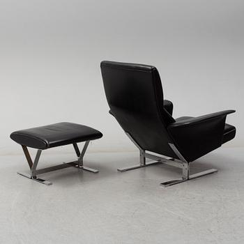 A second half of the 20th century easy chair and stool by Georg Thams, Vejens Polstermöbelfabrik, Denmark.