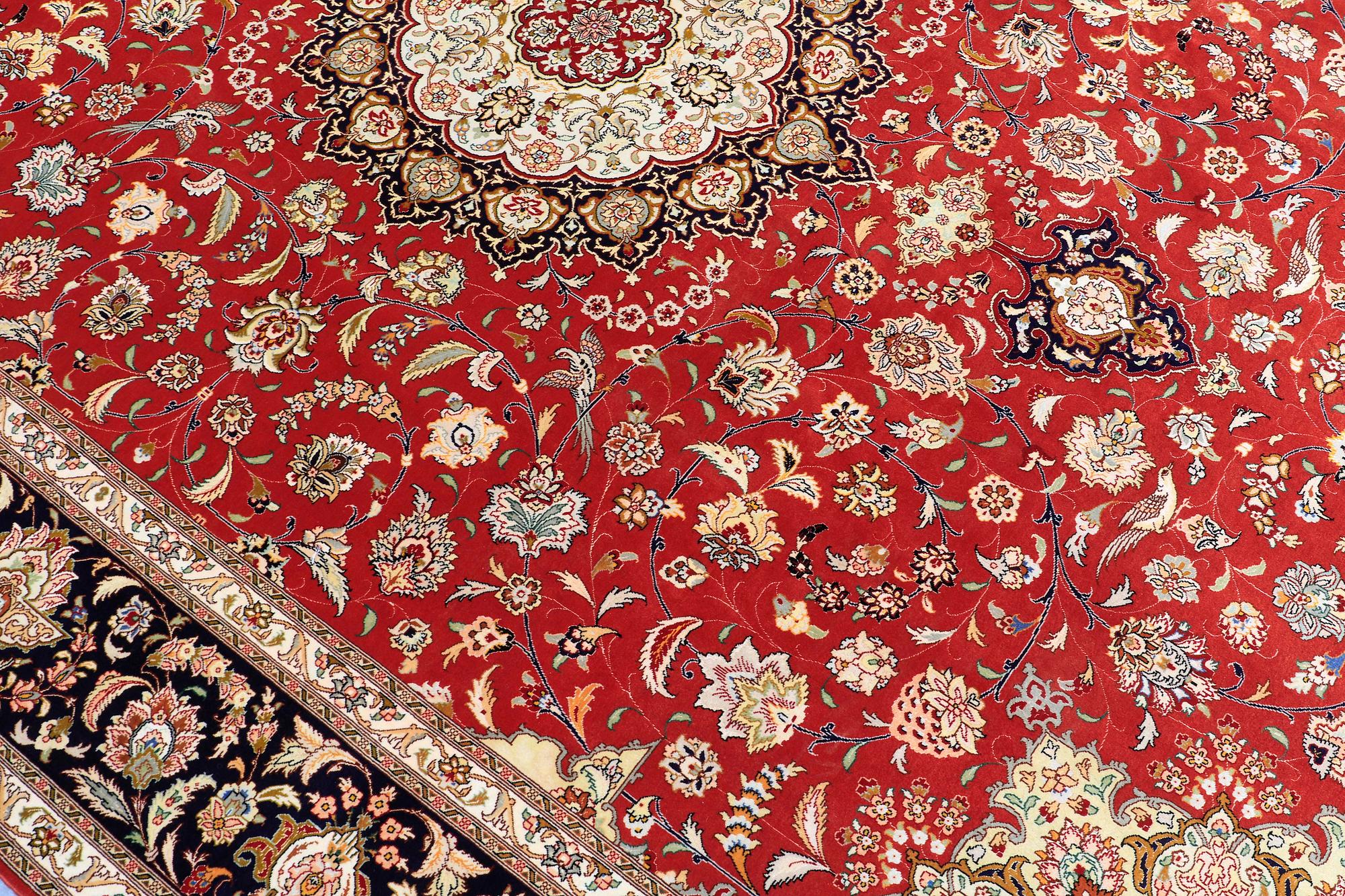 A carpet, Täbriz part silk, 341 x 248 cm.