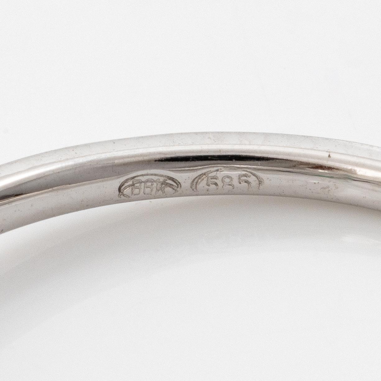 Ring 14K white gold with synthetic emerald and brilliant-cut diamonds.