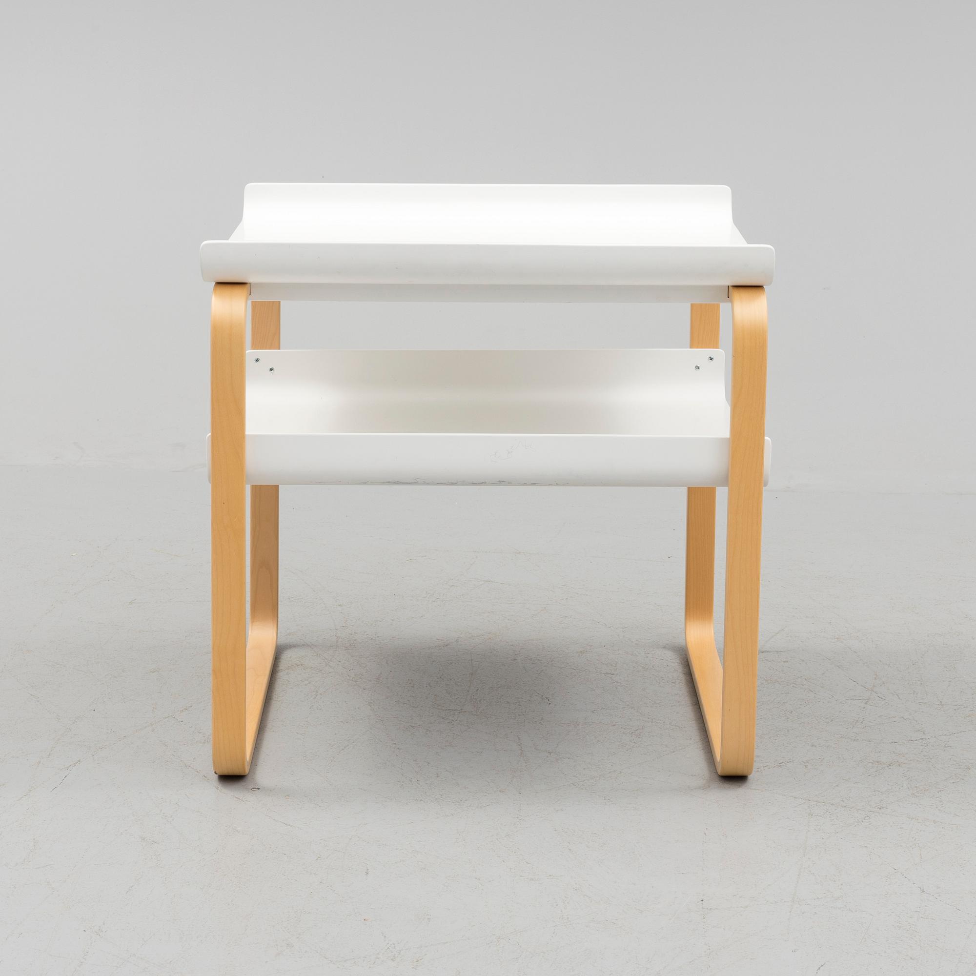 An occational table model 915 by Alvar Aalto for Artek.