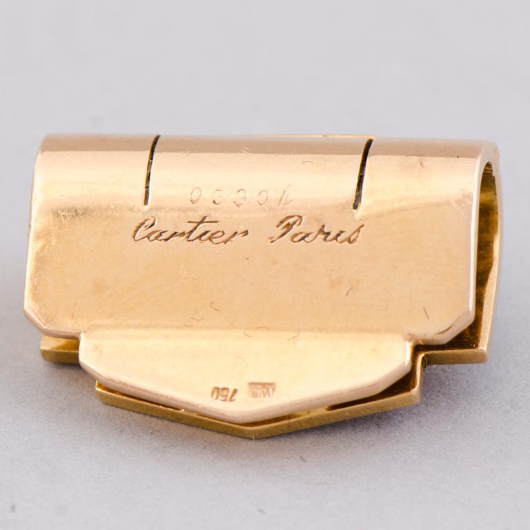 A CARTIER DRESS CLIP, baguette cut diamond, turqouise, 18k gold.