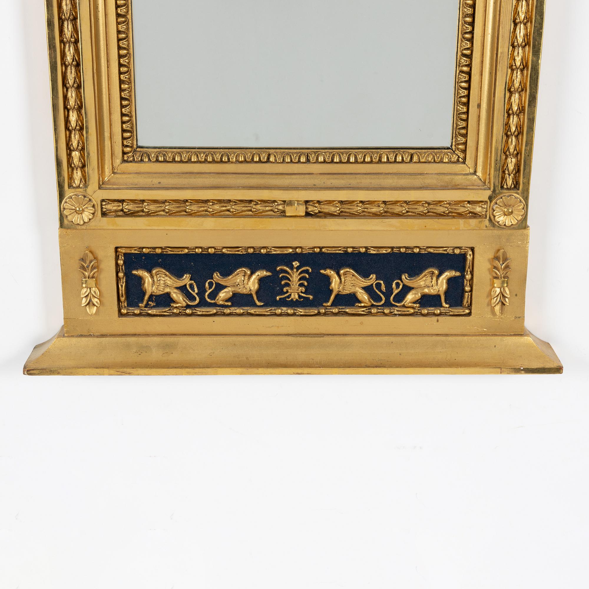 An Empire mirror, first half of the 19th Century.
