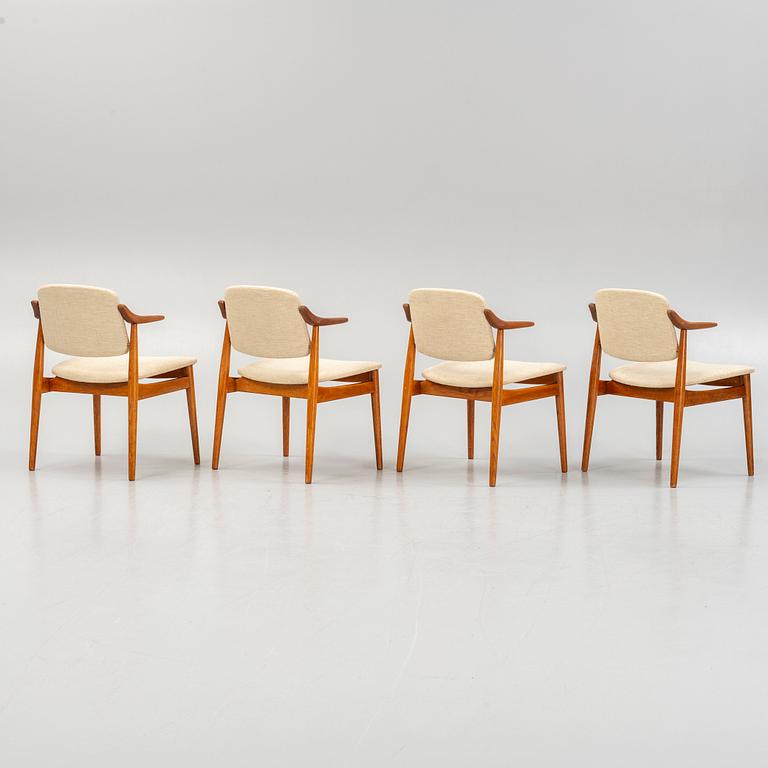 Four teak armchairs, mid 20th century.