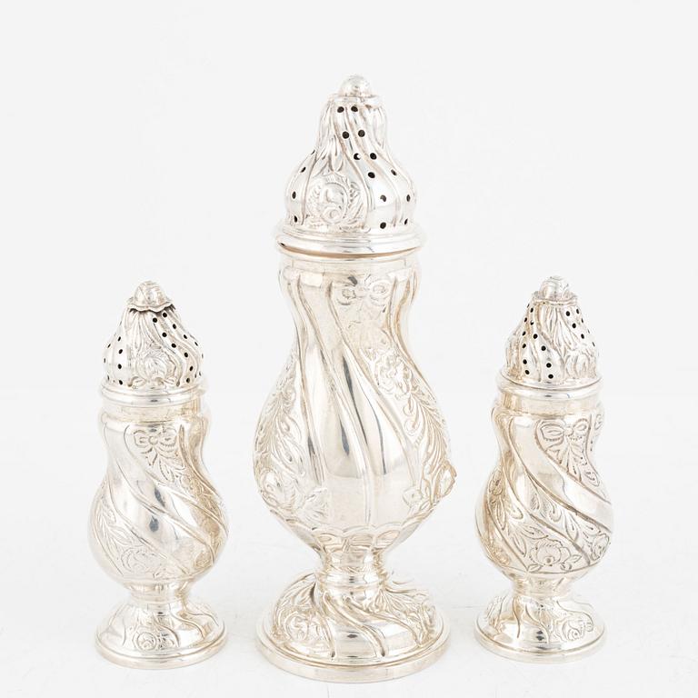 A set of three silver Rococo style shakers, 20th Century.