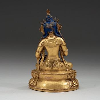 FIGURIN, delvis förgylld och bemålad brons. Vajrasattva, Tibet, 1700-tal.