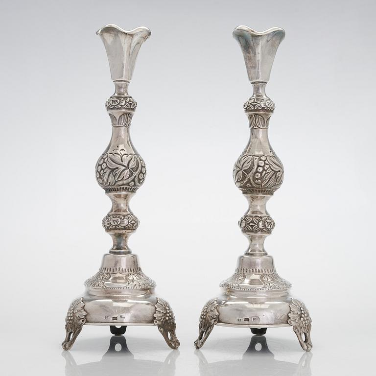 A pair of silver candlesticks from Warsaw, 1880s-90s. Unidentified Cyrillic maker mark FG.