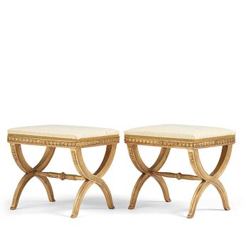 92. A pair of late Gustavian giltwood stools, Stockholm, late 18th century.