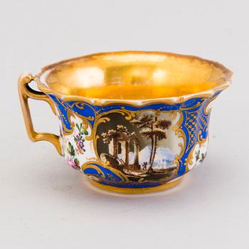 A Popov porcelain cup with saucer, Russia mid-19th Century.