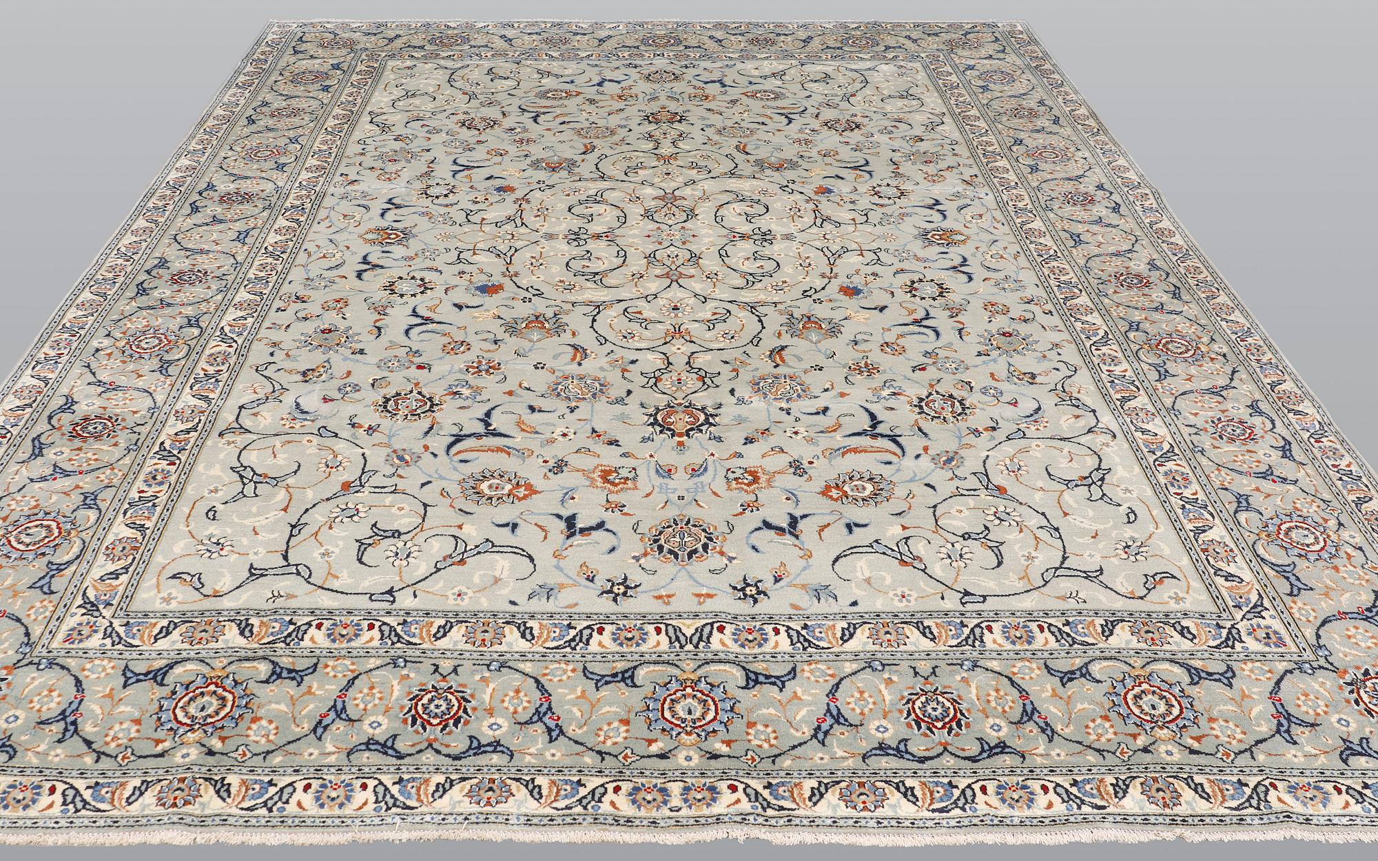A carpet, Kashan, signed, ca 404 x 280 cm.