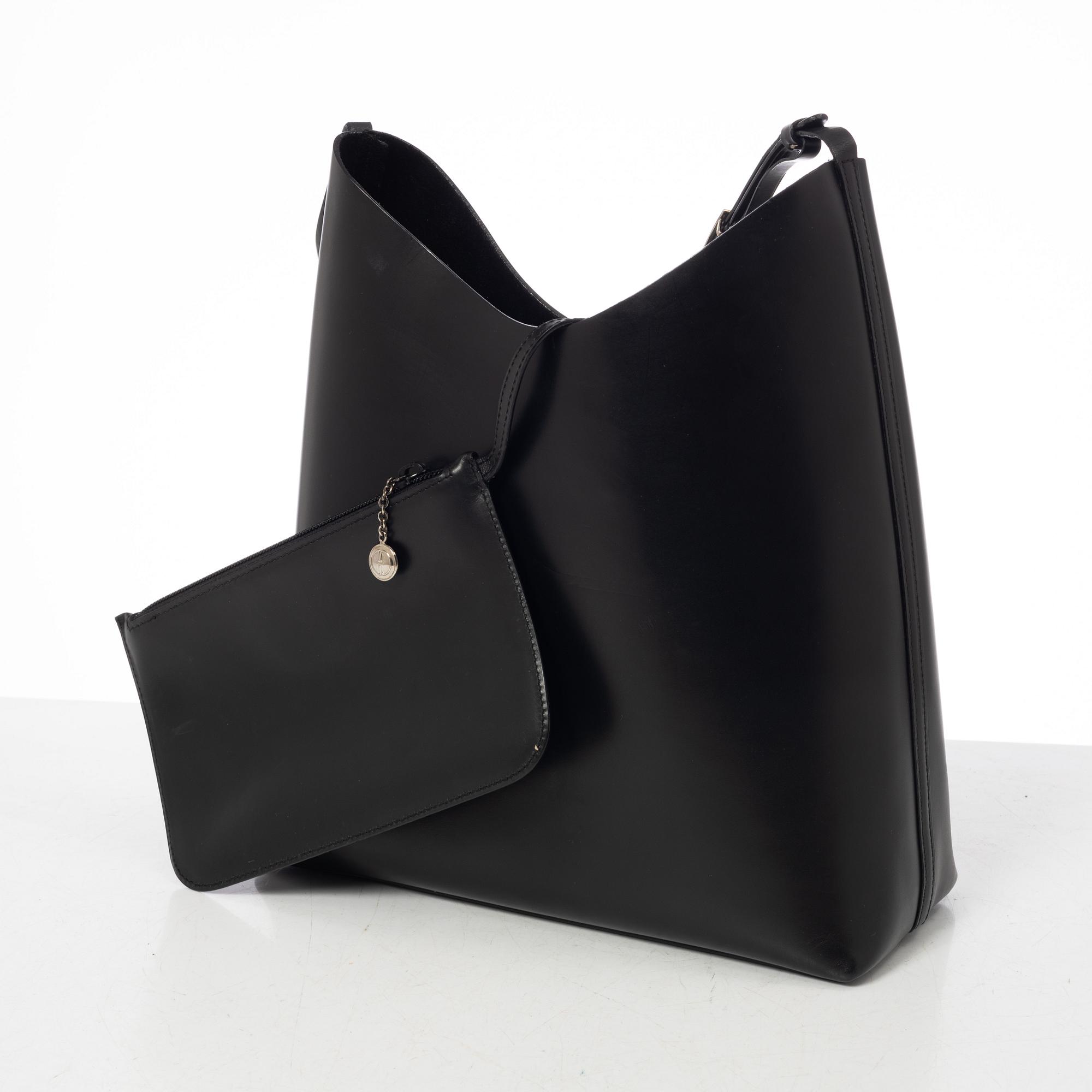 Gucci, A black leather bag.