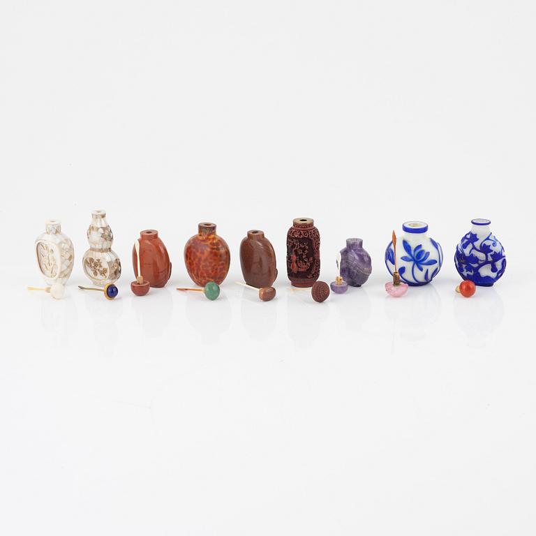 Nine snuff bottles, Peking glass, lacquer, stone and mother of pearl, China, 20th century.