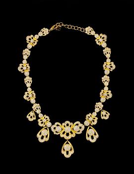 1433. A necklace and a pair of earclips by Christian Dior.