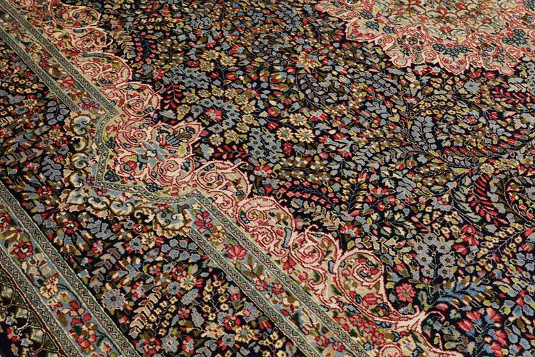 A Kirman Laver carpet, 'Millefleur', approx. 383 x 300 cm.