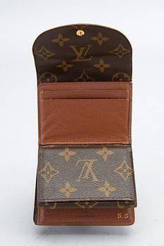 An 'Helene' wallet by Louis Vuitton.