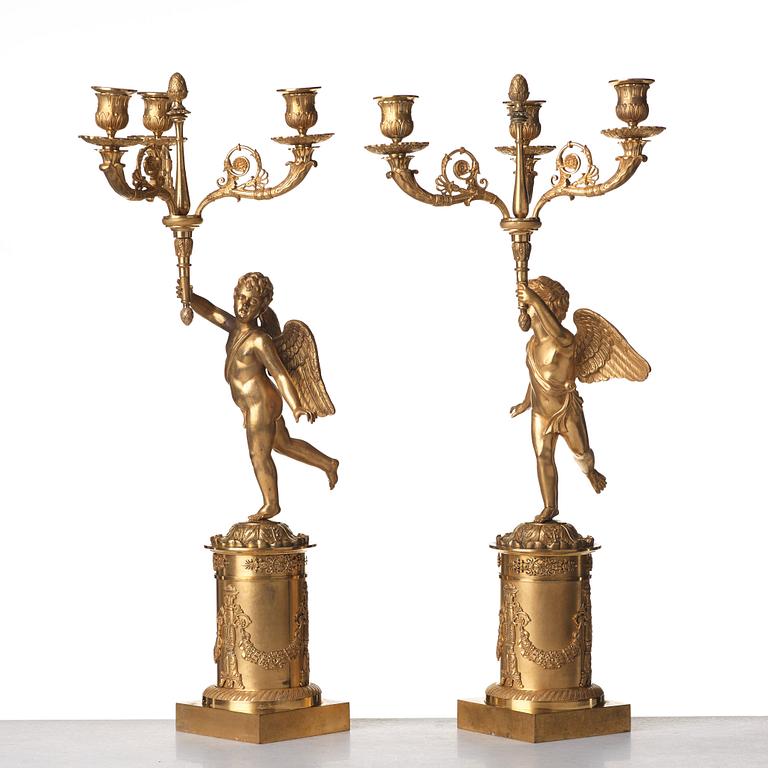 A pair of French Empire three-light candelabra, early 19th century.